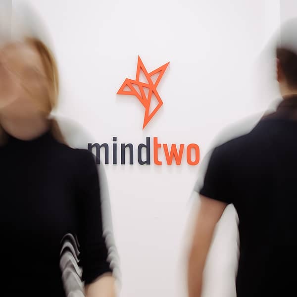 m2-logo-blurry-walking-people-2_1500x1500_square 1